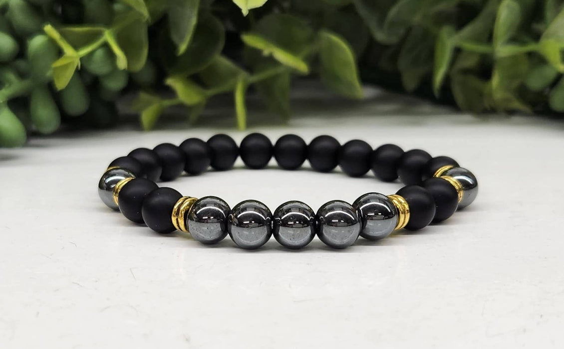 Maadoittava tasapaino: Musta obsidiaani- ja hematiittirannekoru 8 mm