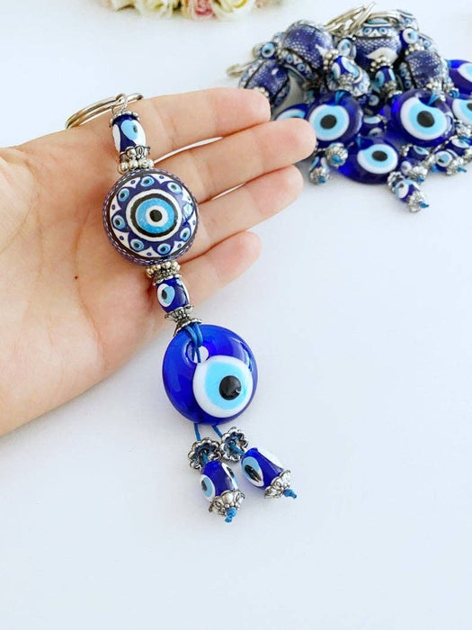 Sininen Evil Eye -avaimenperä keraamisella pallokoristeella