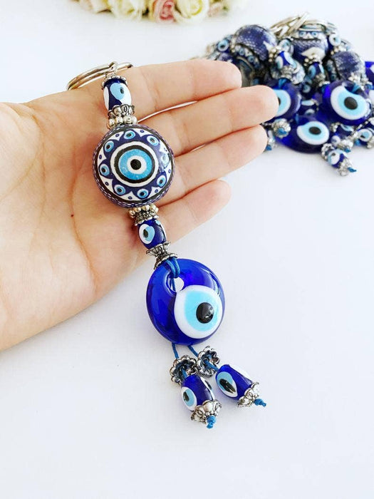 Sininen Evil Eye -avaimenperä keraamisella pallokoristeella