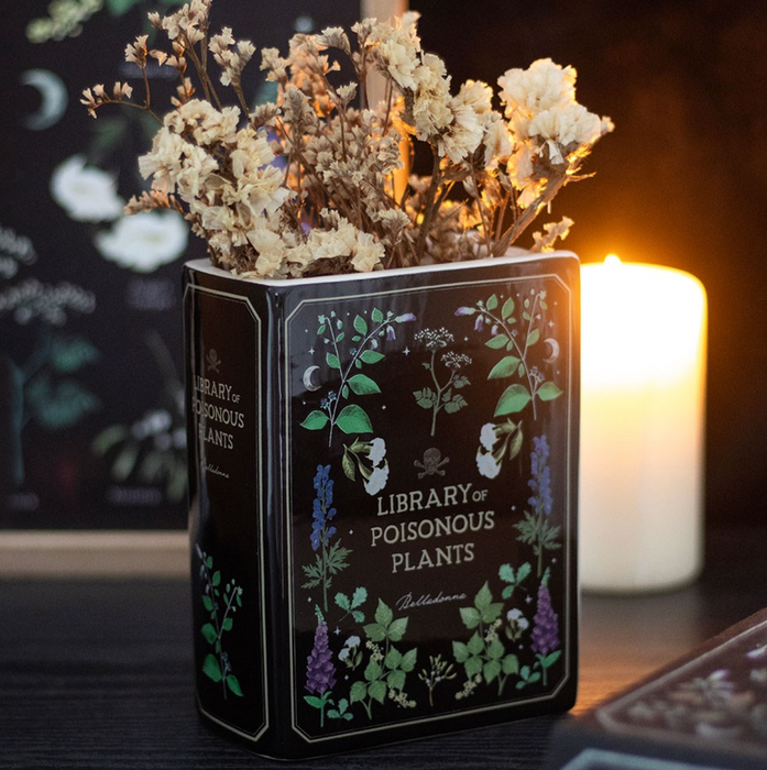 Library of Poisonous Plants -kirjan muotoinen keraaminen maljakko