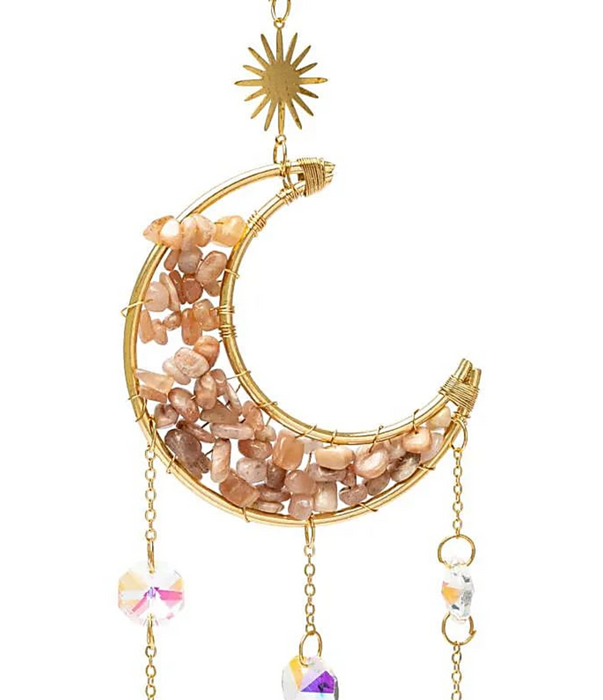 Kuu -aurinkosieppari kuukivellä ja kristalleilla