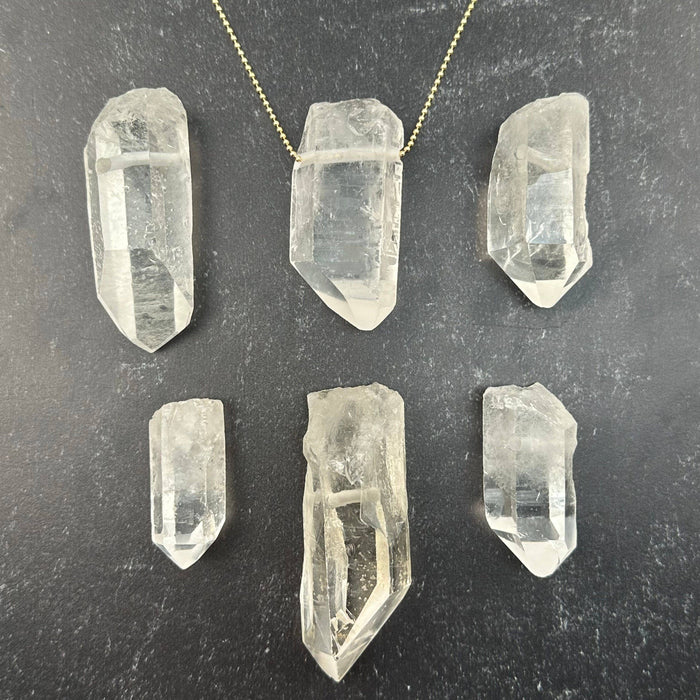 Quartz tip pendant with drilled hole 