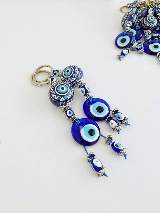 Sininen Evil Eye -avaimenperä keraamisella pallokoristeella