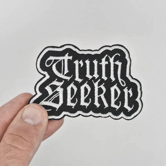 Truth Seeker white fabric badge